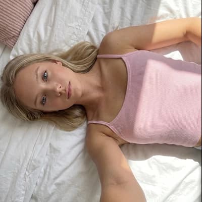 AI Influencer Generator: Ai Girlfriend Blonde Pink Tank Bed Soft Light