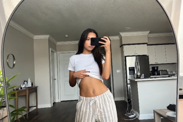 Create your own AI girl: Ai Latina Girlfriend Mirror Selfie White Crop Top